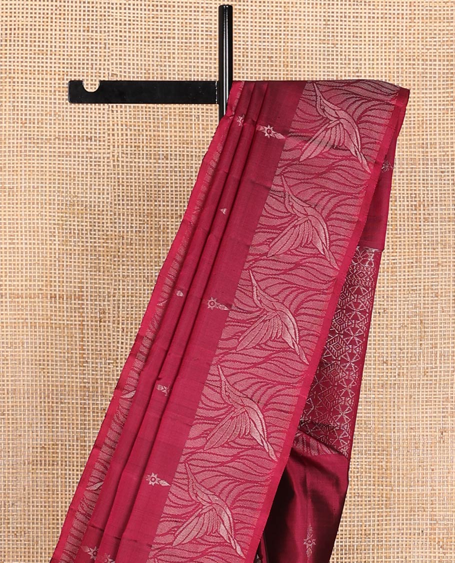 Red Mayuri Soft Silk Saree Subtly Sparkled with Buttas All Over Its Body, Highlighted by Zari Border of Kingfisher Bird Motifs, Pallu Features Geometric Patterns, and Paired with a Matching Blouse