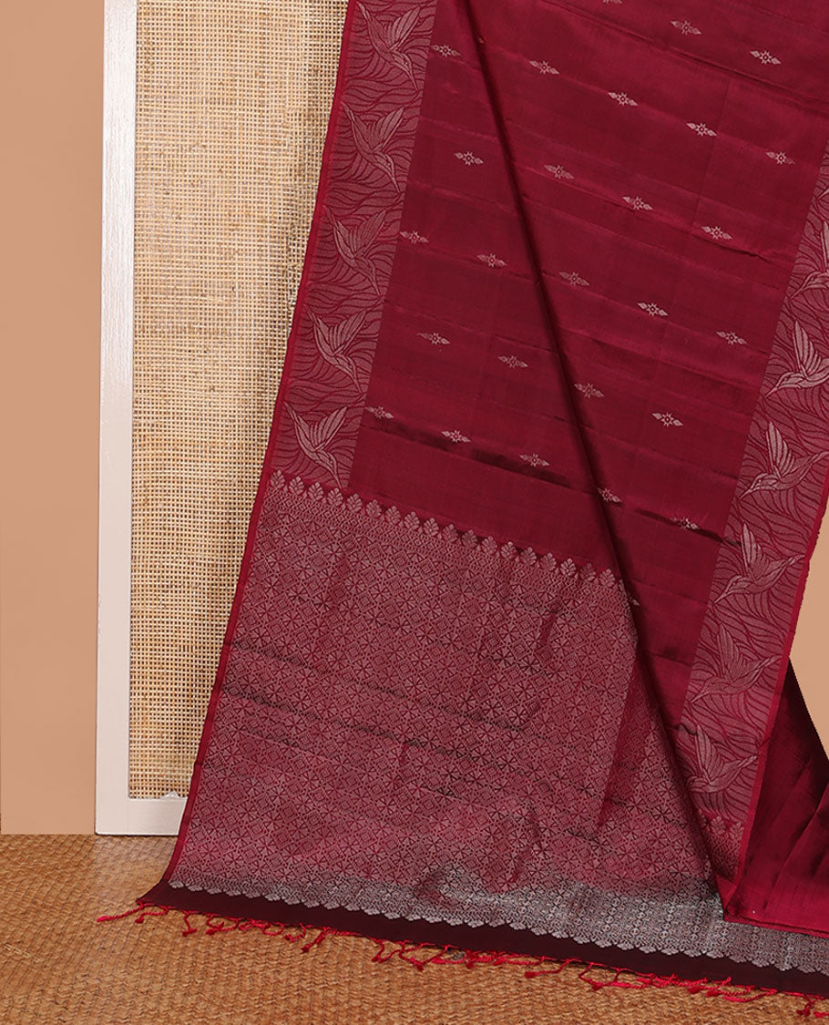 Red Mayuri Soft Silk Saree Subtly Sparkled with Buttas All Over Its Body, Highlighted by Zari Border of Kingfisher Bird Motifs, Pallu Features Geometric Patterns, and Paired with a Matching Blouse