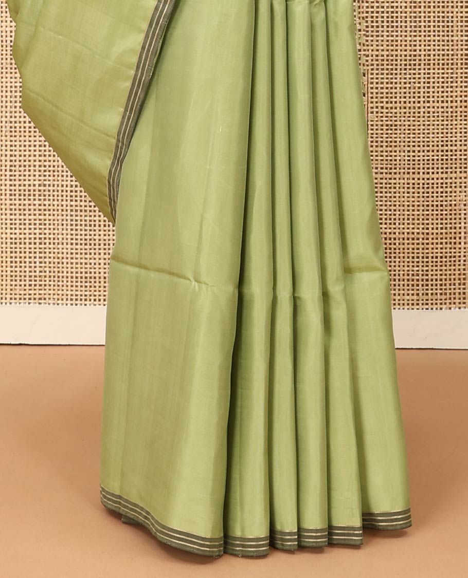 Green tree motifs zari woven soft silk saree, striped piping border, and pallu of zari designs