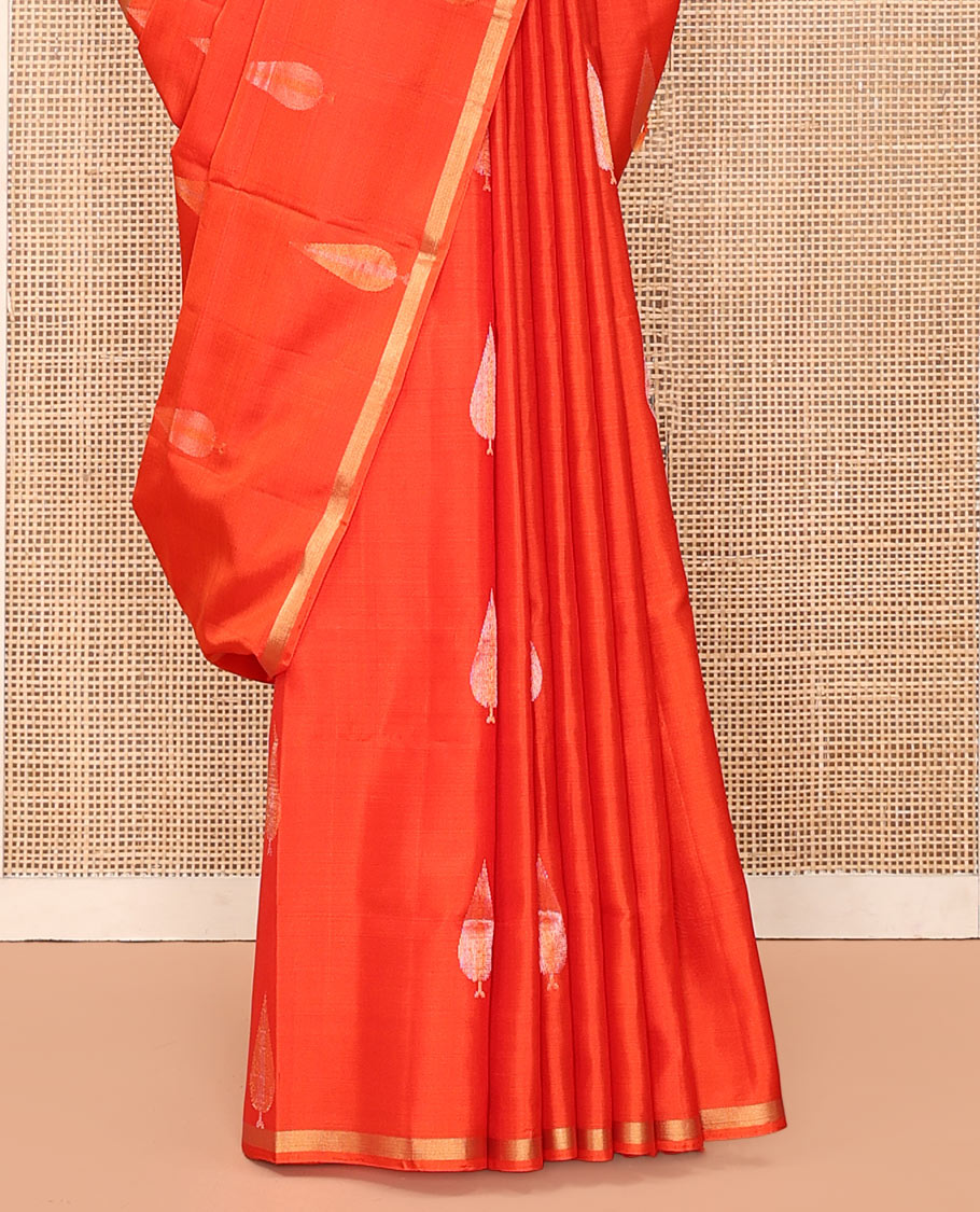 Orange Mayuri Soft Silk Saree, Adorned with Pine-Tree Buttas All Over Its Body, Subtle Zari Piping Border, Sparsely Woven Pallu, and Paired with a Matching Blouse