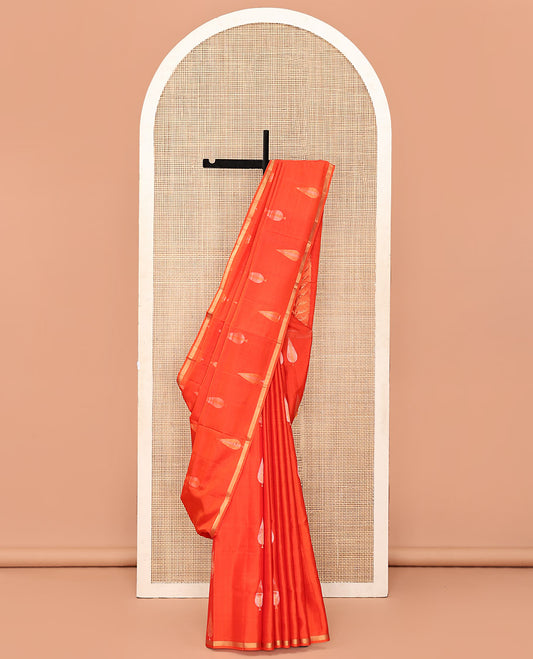 Orange Mayuri Soft Silk Saree, Adorned with Pine-Tree Buttas All Over Its Body, Subtle Zari Piping Border, Sparsely Woven Pallu, and Paired with a Matching Blouse