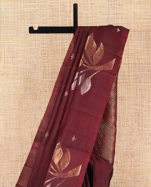 Borderless Maroon Mayuri Soft Silk Saree, Adorned with Buttas and Tree Buttas All Over Its Body, Subtle Pallu of Diagonal Vine Designs, and Paired with a Matching Blouse