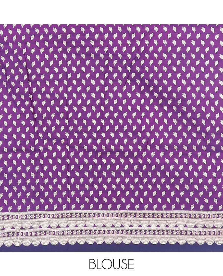 Purple plain mushru silk saree, self-border of scallop design, floral, and tree motifs, and intricately designed pallu