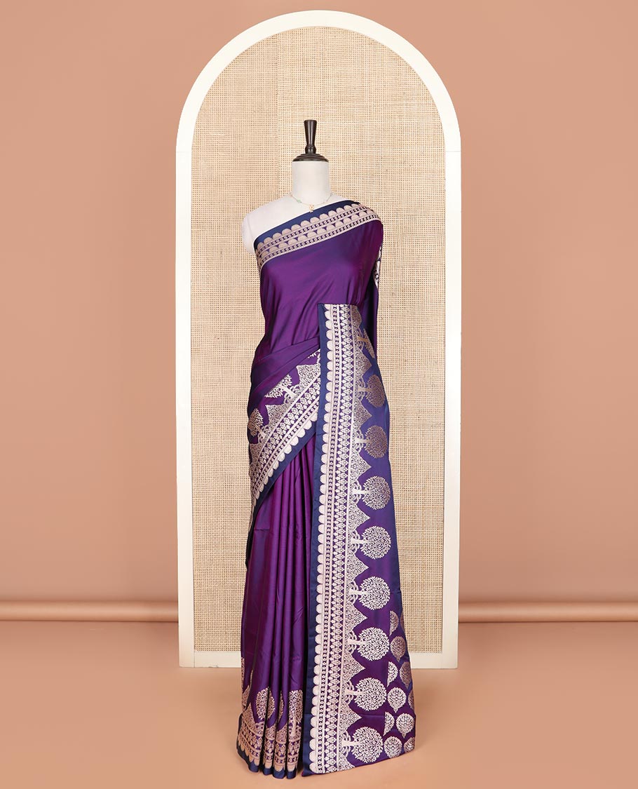 Purple plain mushru silk saree, self-border of scallop design, floral, and tree motifs, and intricately designed pallu