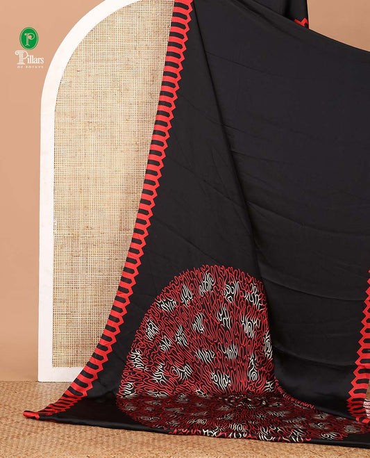 Black plain gajji silk saree features a temple-printed border, a circular-shaped vine-patterned pallu, and a unique motif-printed blouse