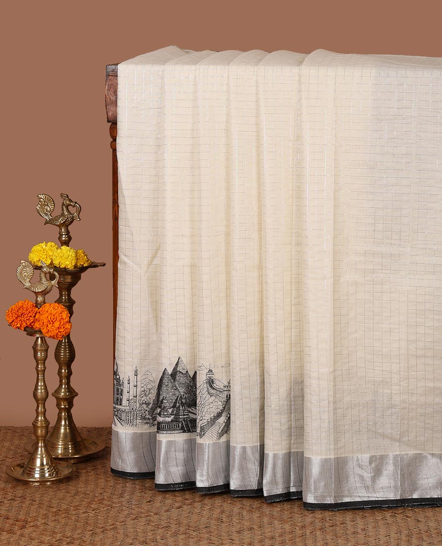 Half-white zari checked Kerala saree,bavanji border & pallu delicately printed with 7-wonders of the world motifs, zari design blouse