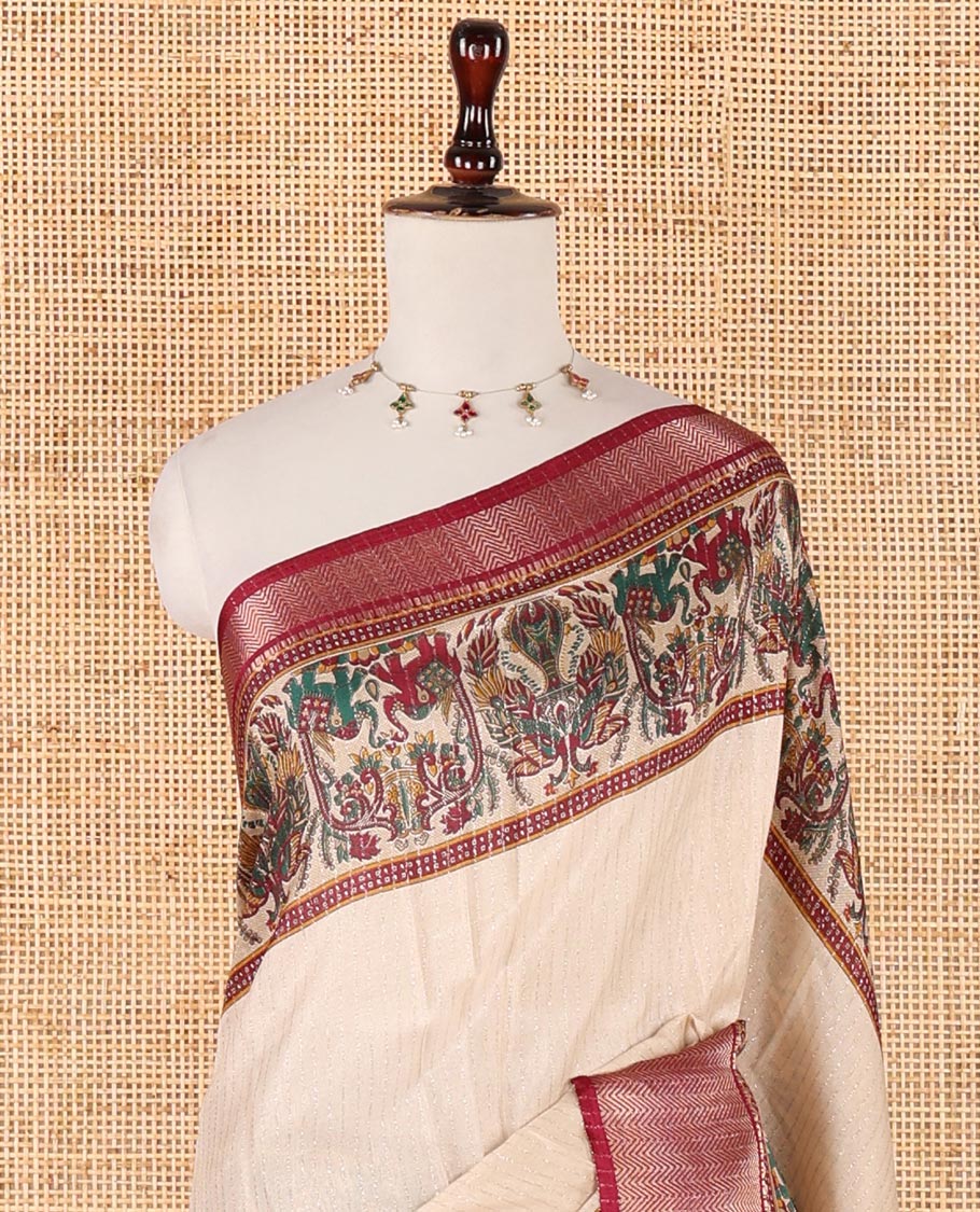 Cream zari striped dola silksaree,contrast purple zari border & pallu of kalamkari animal print, ajrakh printed blouse