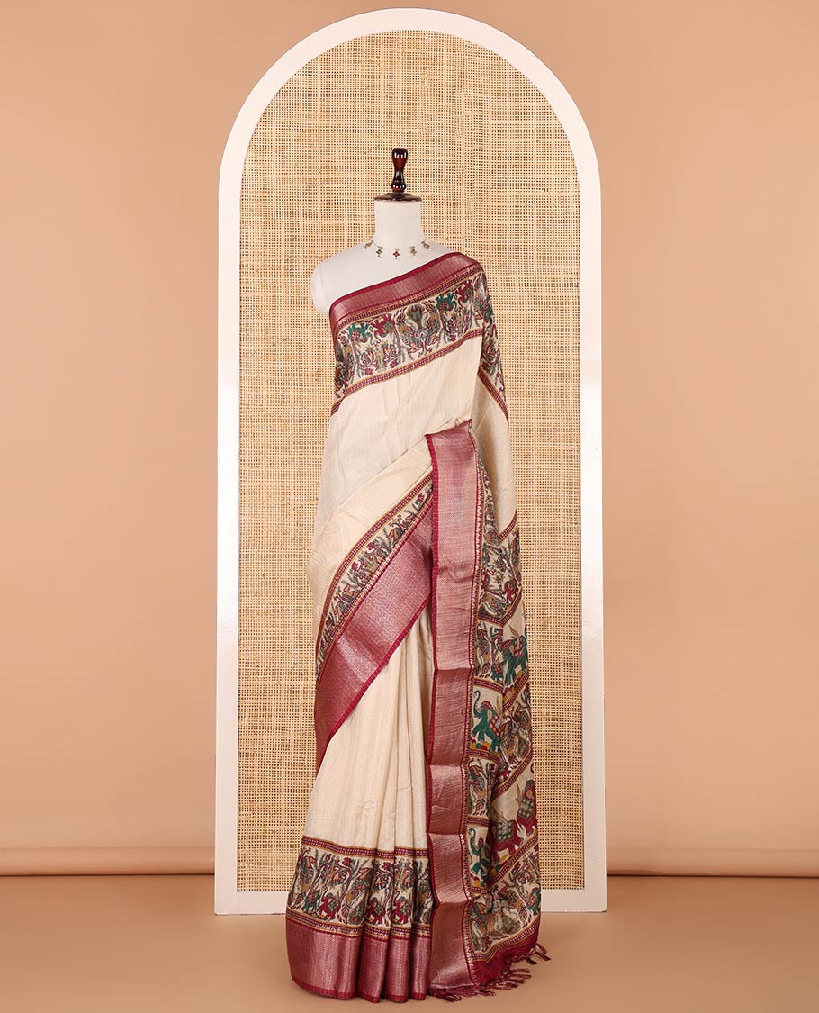 Cream zari striped dola silksaree,contrast purple zari border & pallu of kalamkari animal print, ajrakh printed blouse