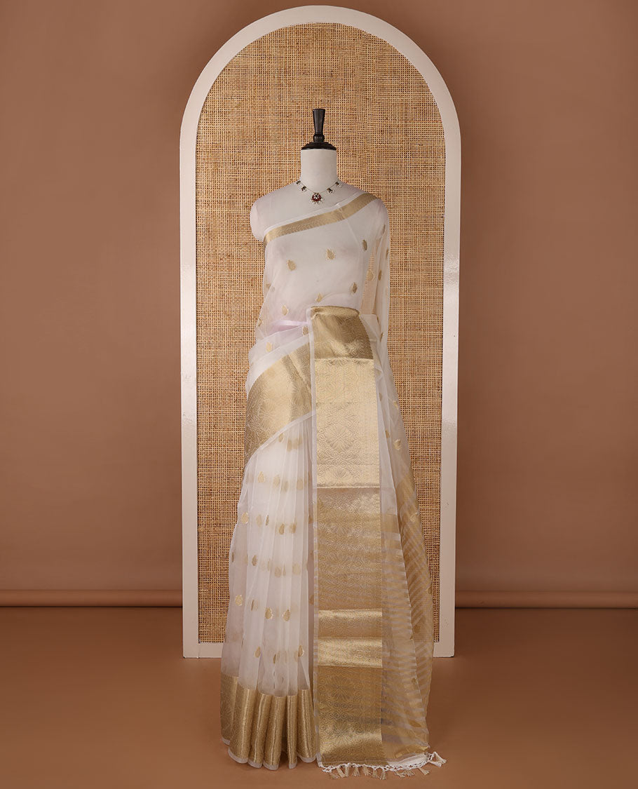 White semi-organza saree with zari buttas, zari border of temple & floral creeper designs, zari design pallu & running blouse