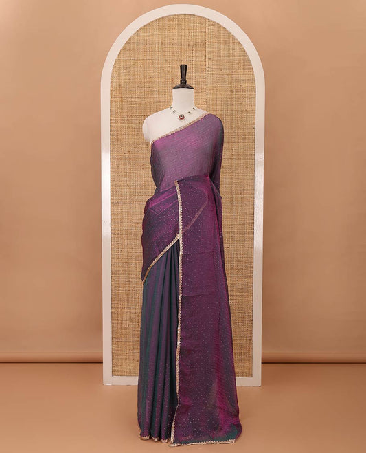 Dark violet Swarovski stone work embedded fendy-chiffon saree, scallop lace border & floral mixed embroidered blouse