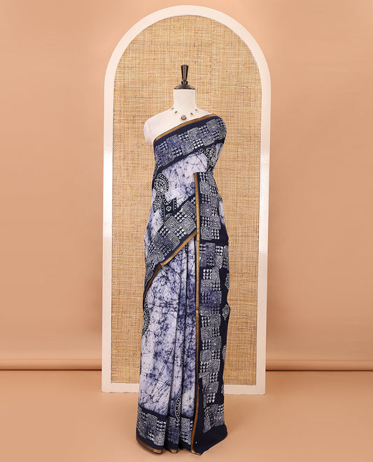 Navy blue batik-printed sungudi cotton saree, mango zari small border, batik-printed pallu & running blouse