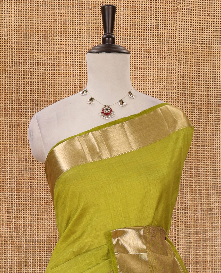 Green plain tussar saree, traditional zari design border, pallu of zari stripes & matching traditional motif border blouse
