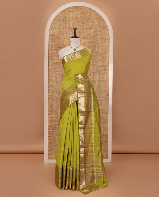 Green plain tussar saree, traditional zari design border, pallu of zari stripes & matching traditional motif border blouse