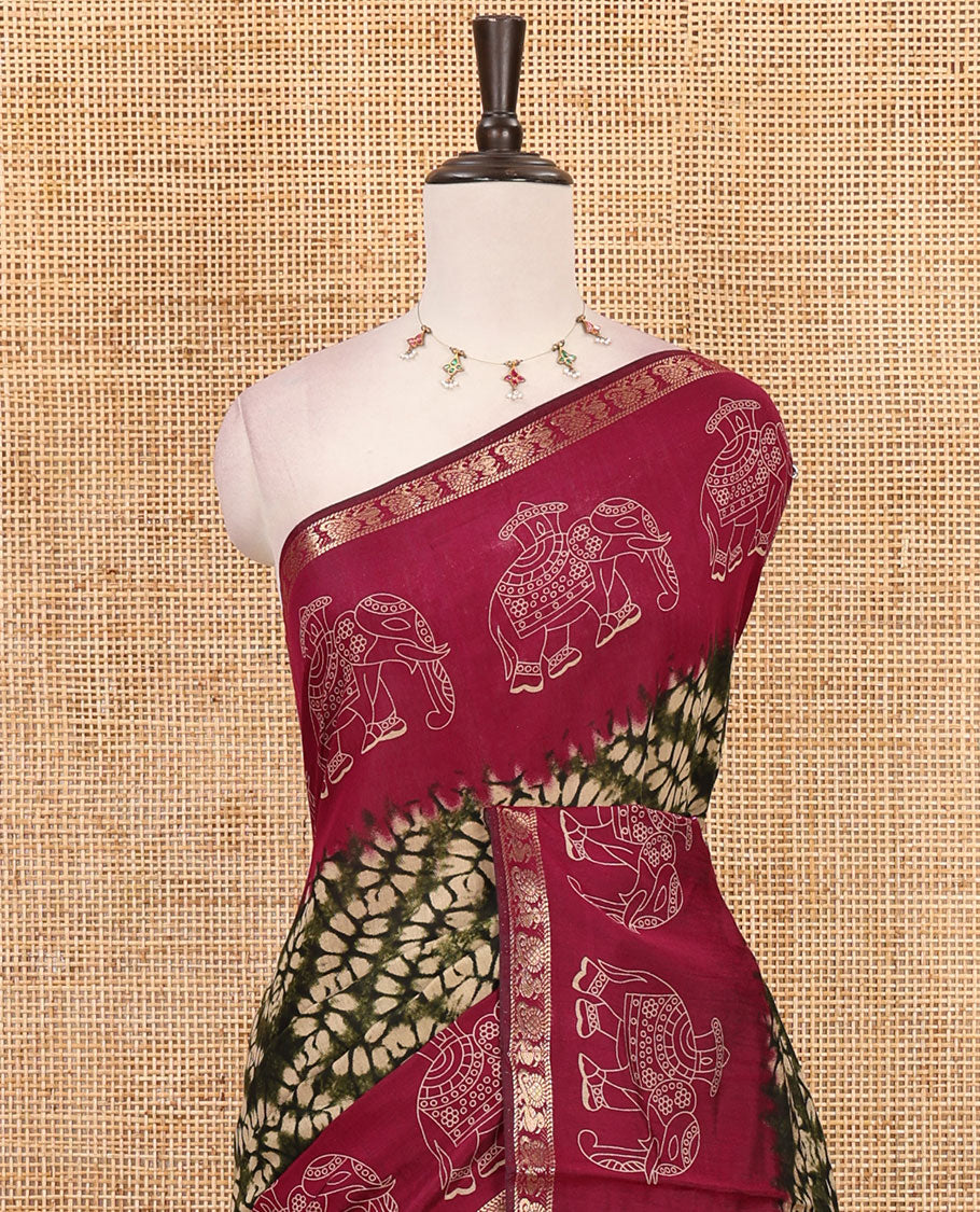 Olive green diamond patterns Shibori-style printed muslin cotton saree, contrast elephant motifs printed border, batik elephant motifs pallu & contrast flower buttas printed blouse