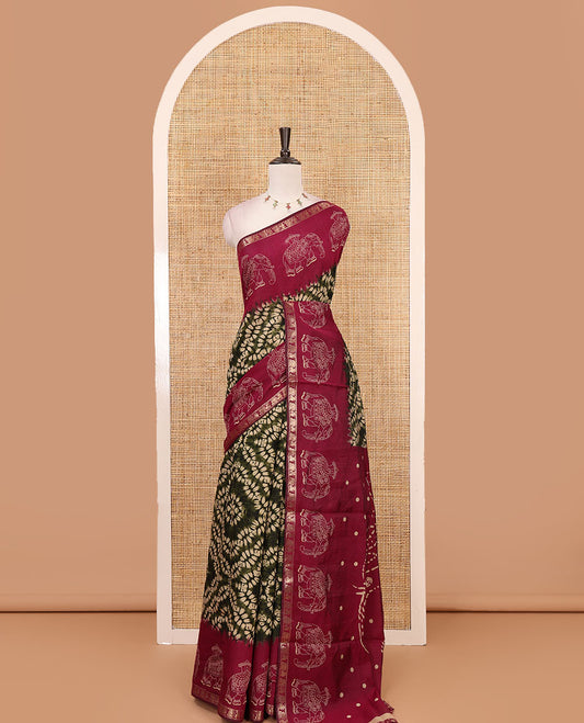 Olive green diamond patterns Shibori-style printed muslin cotton saree, contrast elephant motifs printed border, batik elephant motifs pallu & contrast flower buttas printed blouse