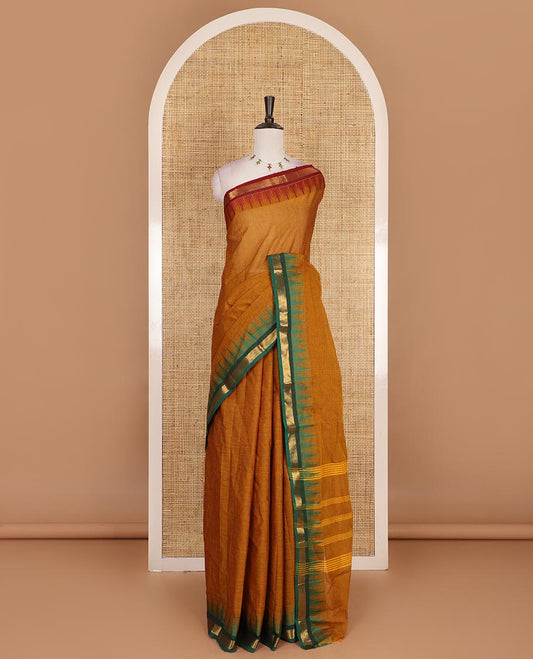 Mustard plain Chettinad cotton saree, contrast ganga jamuna temple zari border, striped pallu, and plain blouse