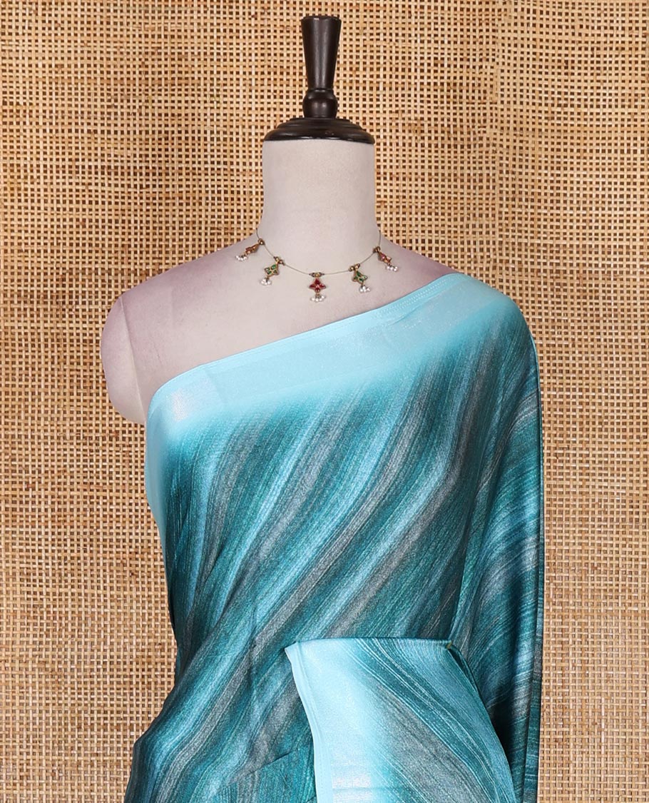 Blue leheriya style hand brush printed satin crepe saree, contrast border, plain pallu, and floral vine printed blouse