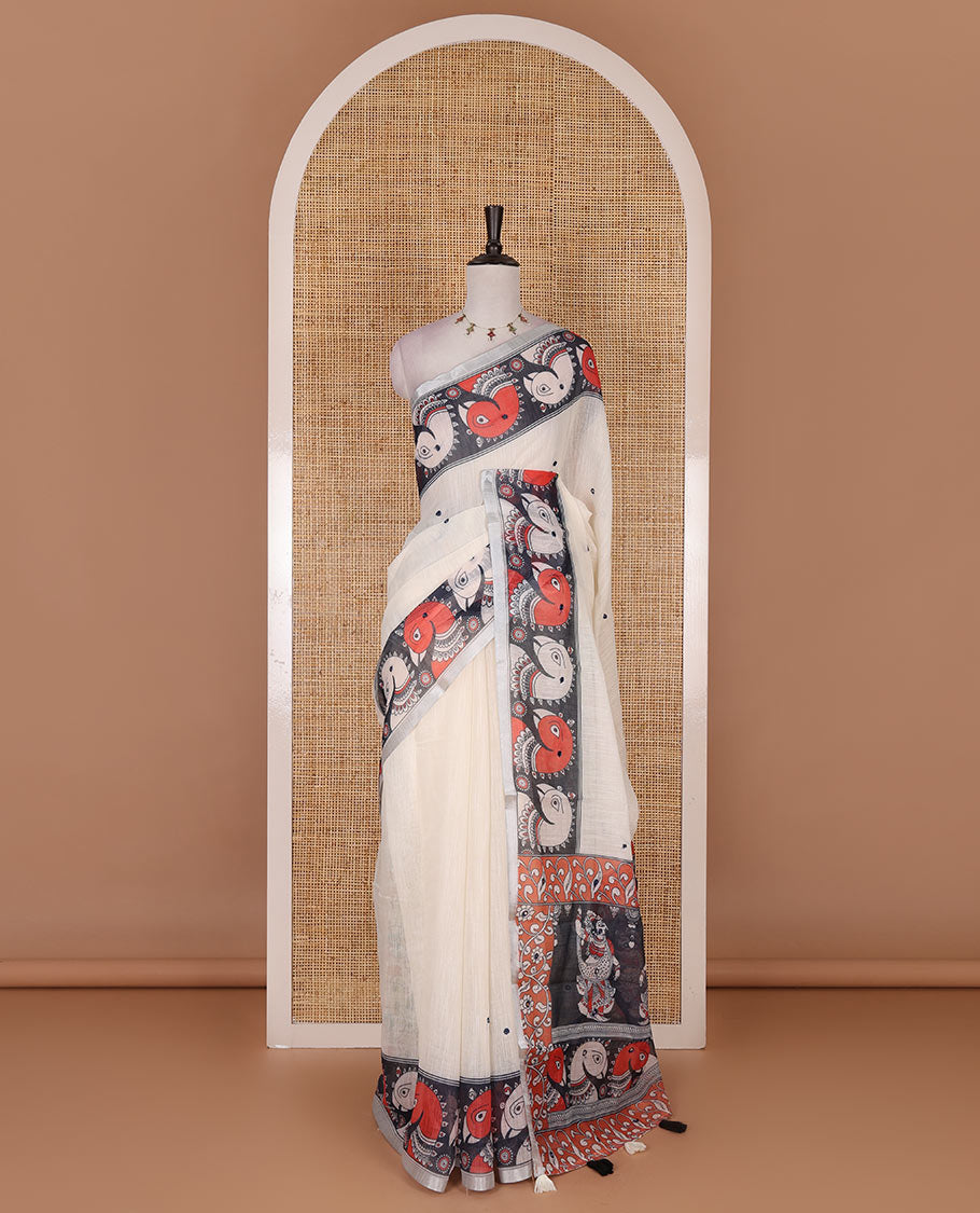 Cream mirror thread embroidered linen saree, contrast kalamkari peacock printed border, pallu of kalamkari peacock and human figurines print, and printed blouse