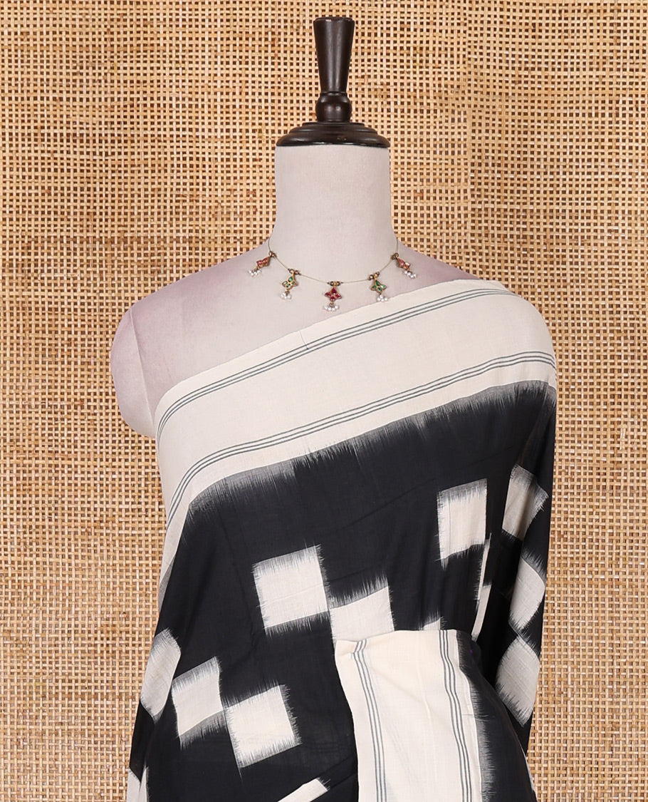 Black and white checked blocks patterned ikkat cotton saree, contrast plain border, striped pallu, and contrast plain blouse