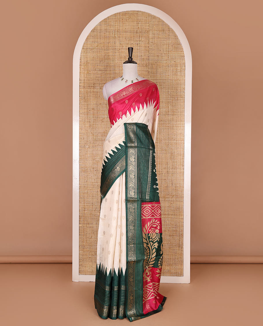 Cream zari buttas dola silk saree, contrast pink-green temple ganga jamuna traditional zari border, paisley pallu, and contrast zari design blouse