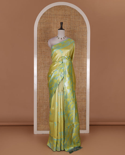 Green jacquard kanchi silk saree, contrast border, and pallu steeped with paisley motifs with contrast zari design blouse