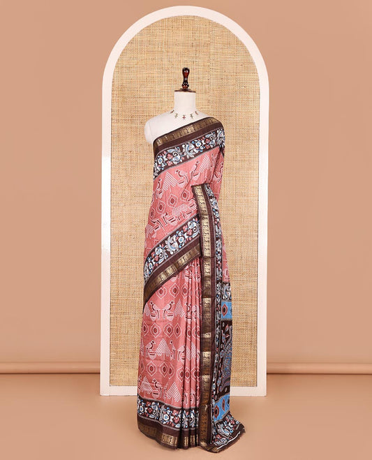 Peach pochampally ikkat parrot motifs printed dola silk saree, contrast border of kalamkari printed with zari work, kalamkari peacock printed pallu, and contrast zari design blouse