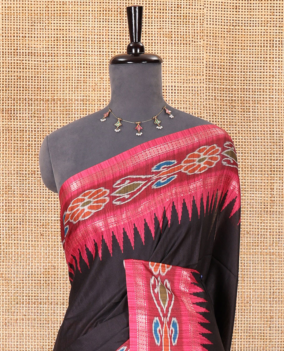 Black plain Katan silk saree, contrast temple ikkat floral printed border, ikkat floral printed pallu, and ikkat printed blouse