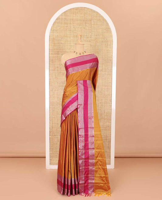Gold plain semi-soft silk saree with contrast plain border of stripes, striped pallu, and a matching blouse