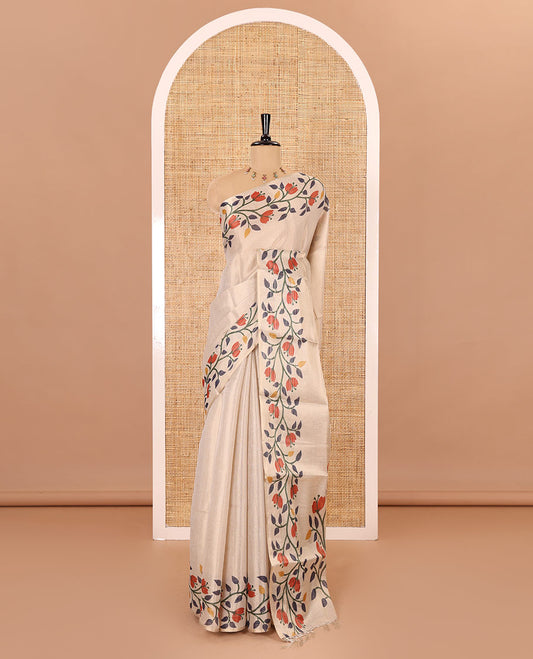 Cream plain tissue saree, printed border and pallu of jamdani floral vine print, and a matching floral buttas printed blouse