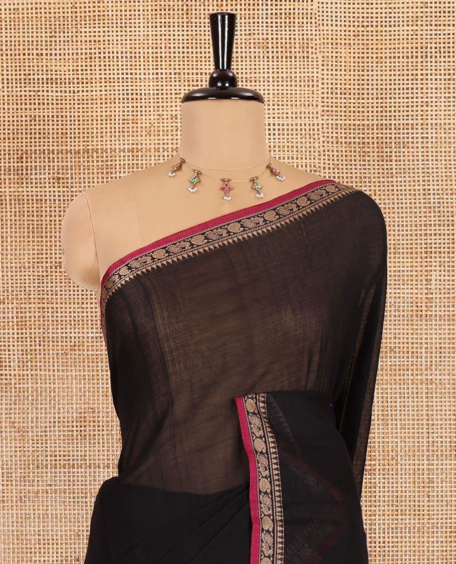 Black plain mercerised cotton saree, contrast temple traditional border, striped pallu, and a matching blouse