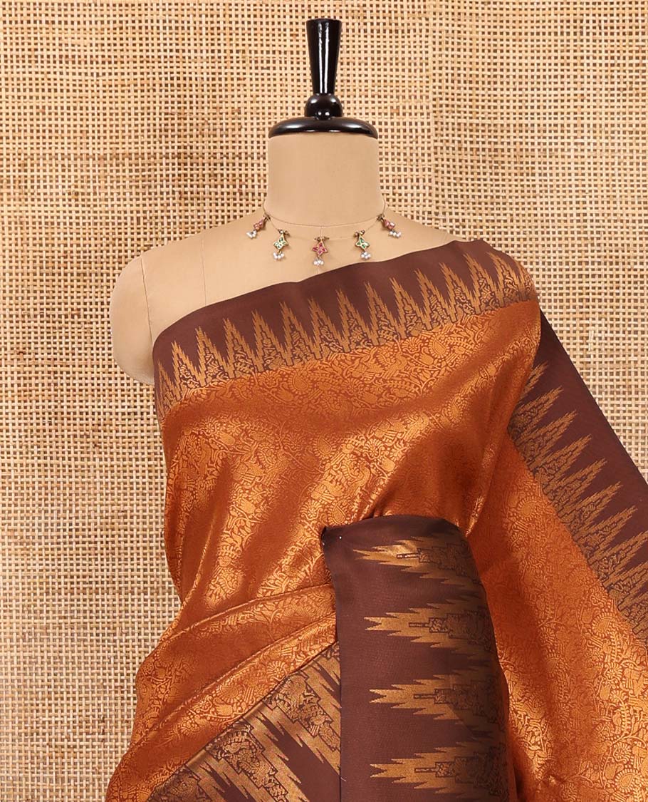 Rust orange-brown floral and bird jacquard kanchi silk saree, contrast temple border, zari-rich jaal pallu, and a jacquard blouse