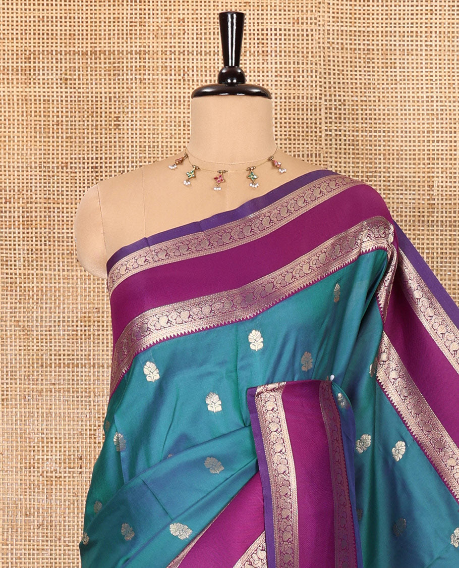 Blue zari buttas kanchi soft silk saree, contrast manga and peacock motifs woven rettai pettu border, ogee patterned pallu, and a zari design blouse