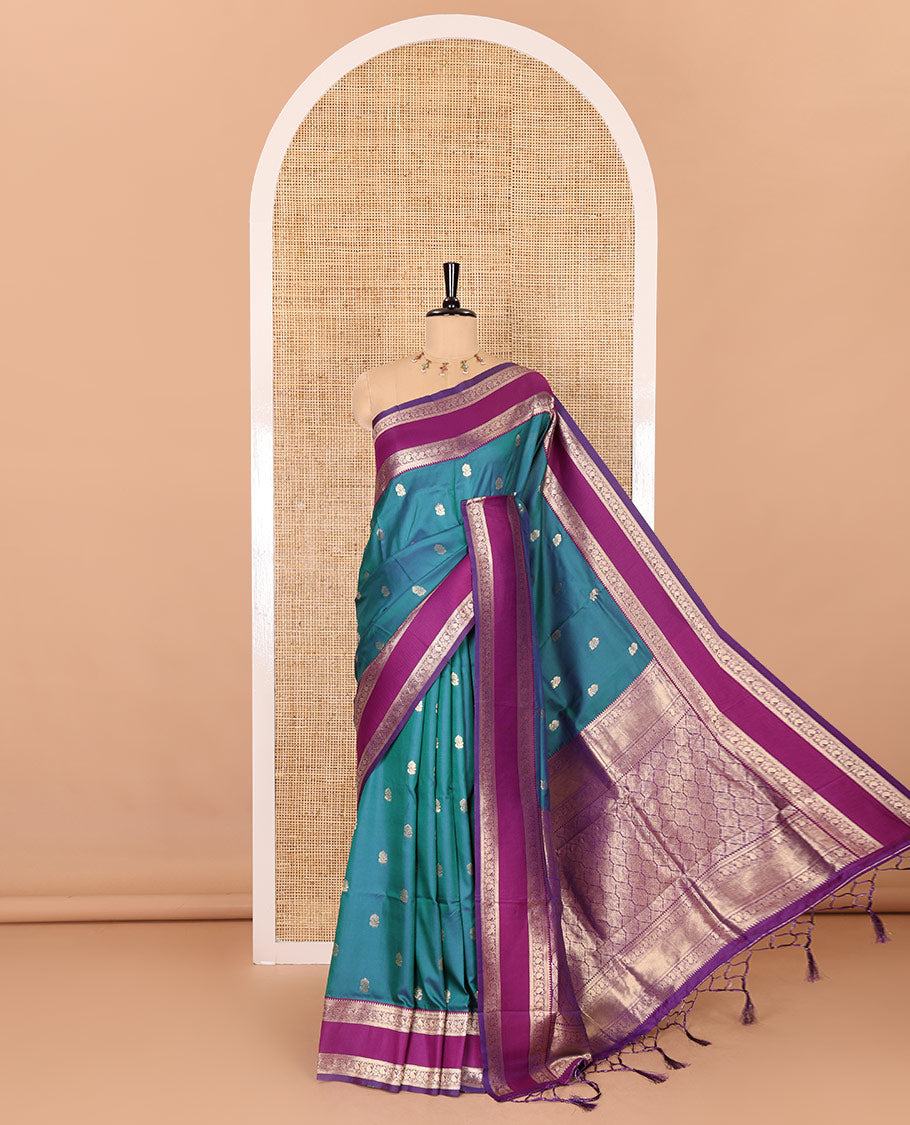 Blue zari buttas kanchi soft silk saree, contrast manga and peacock motifs woven rettai pettu border, ogee patterned pallu, and a zari design blouse