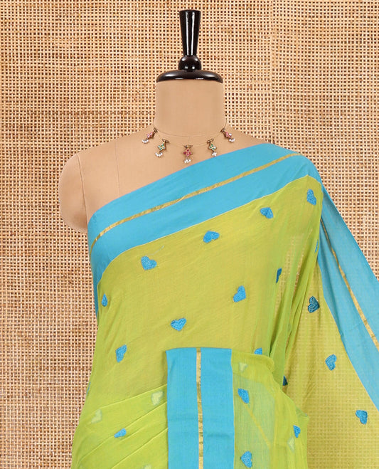 Parrot green heart motif thread-embroidered khadi mul cotton saree, contrast zari striped border, self-pallu with tassels, and a plain blouse