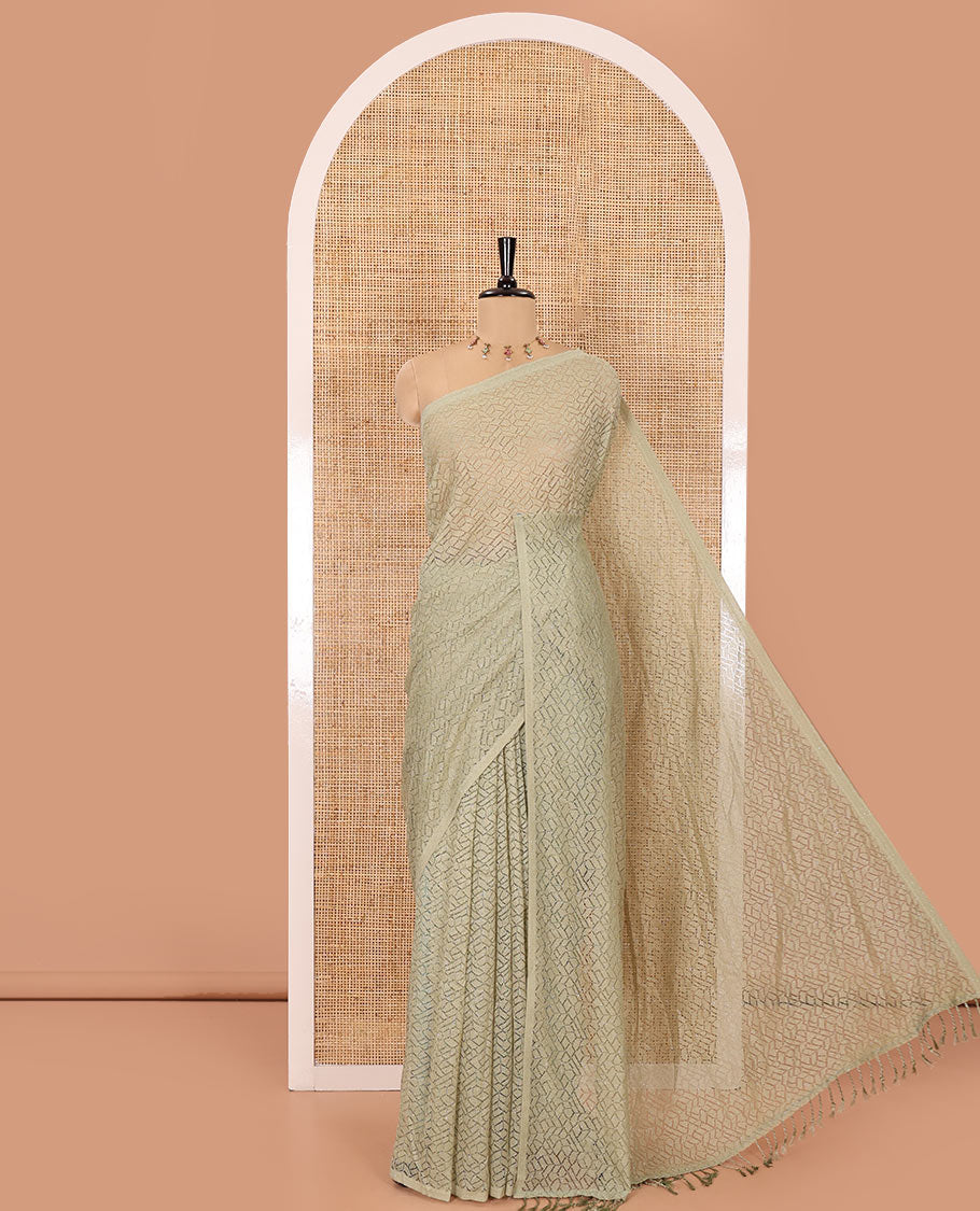 Borderless pista green sparkling glittered russel net saree, self-pallu and a floral print with zig-zag embroidered blouse