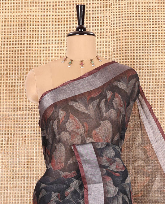 Black Printed Linen Cotton Saree Embellished with Floral Motifs, Complemented by a Contrast Bavanji Border, Featuring Floral Printed Pallu, Paired with a Subtle Matching Blouse