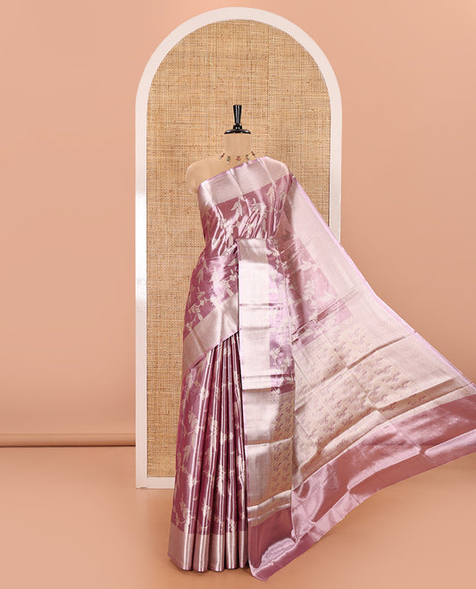 Lavender Tissue Silk Saree Adorned with Floral Vine Brocade in Rose Copper Zari, Featuring a Traditional Zari Design Border, Pallu Steeped with Floral Motifs, and Paired with a Matching Floral Brocade Blouse