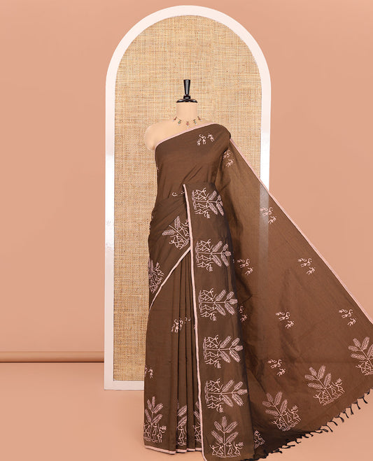 Brown South Cotton Saree, Embellished with Warli Motifs Handblock Printed All Over Its Body, Subtly Block Printed Border, Paired with a Matching Blouse, and a Contrast Floral Vine Block Printed Blouse