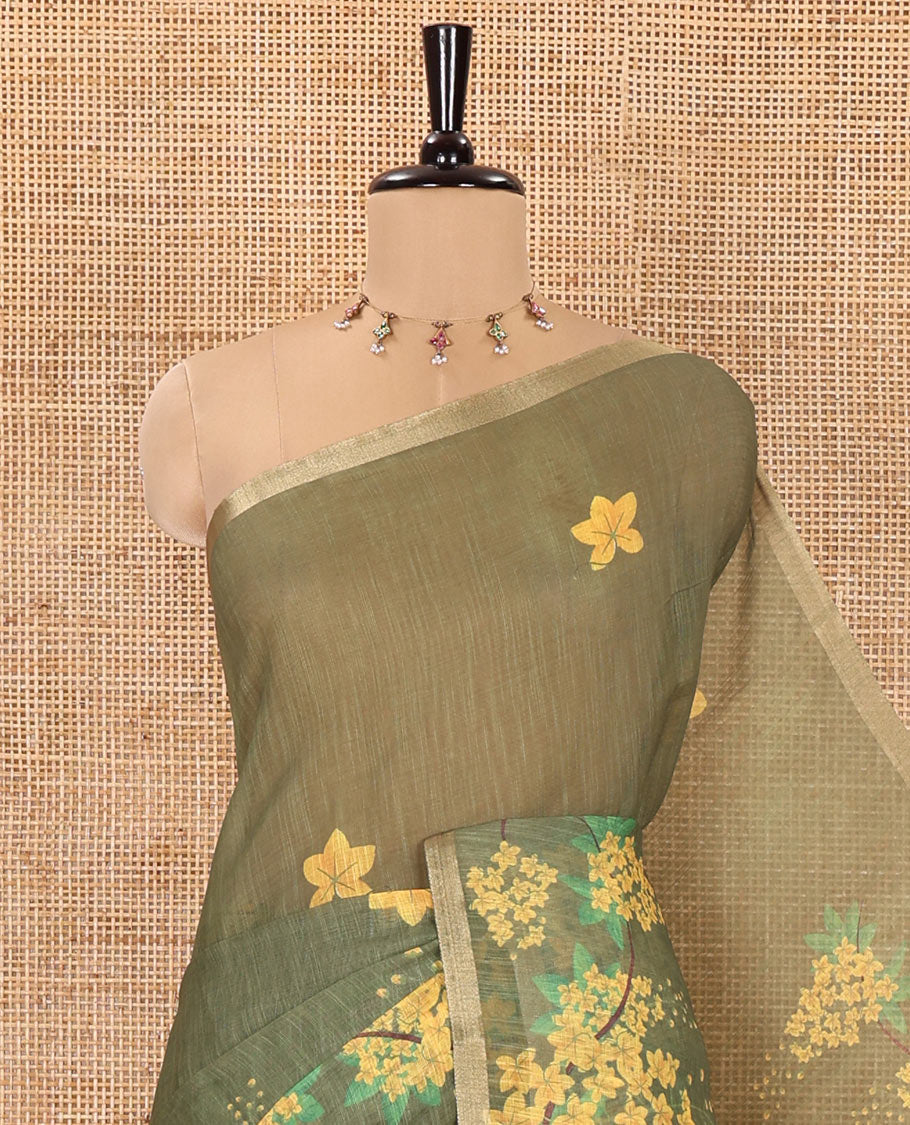 Green Linen Saree, Detailed with Averrhoa Carambola-Style Floral Motifs Print, Subtle Piping Border, Pallu Mirrors the Same Print, and Paired with a Matching Blouse
