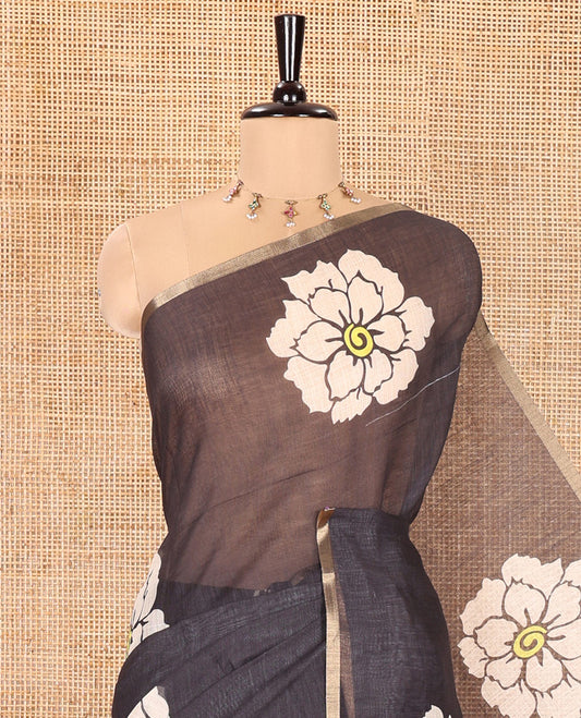 Black Linen Cotton Saree, Beautified with Flower Motifs Printed on Its Body, Subtle Piping Border, Self-Printed Pallu, and Paired with a Matching Blouse