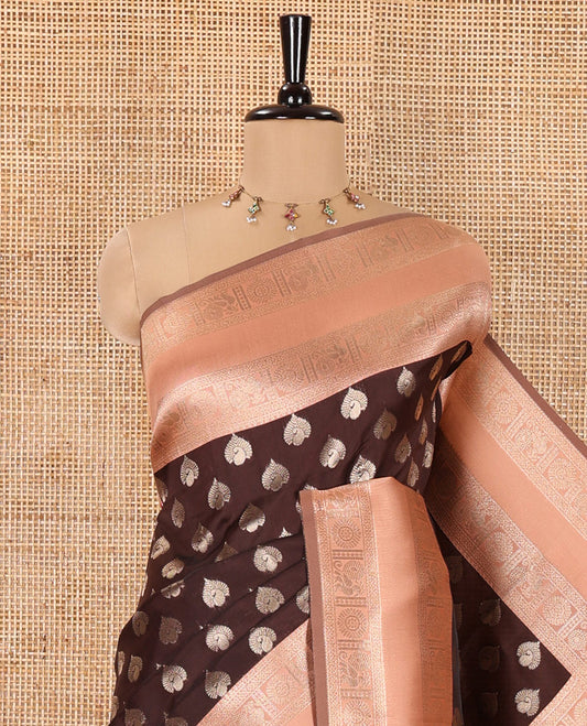 Brown and Peach Kanchi Silk Saree, Artfully Detailed with Zari Buttas All Over Its Body, Complemented by a Contrast Traditional Zari Rettai Pettu Border of Peacock-Chakram Designs, Intricately Designed Grand Pallu, and Paired with a Contrast Blouse