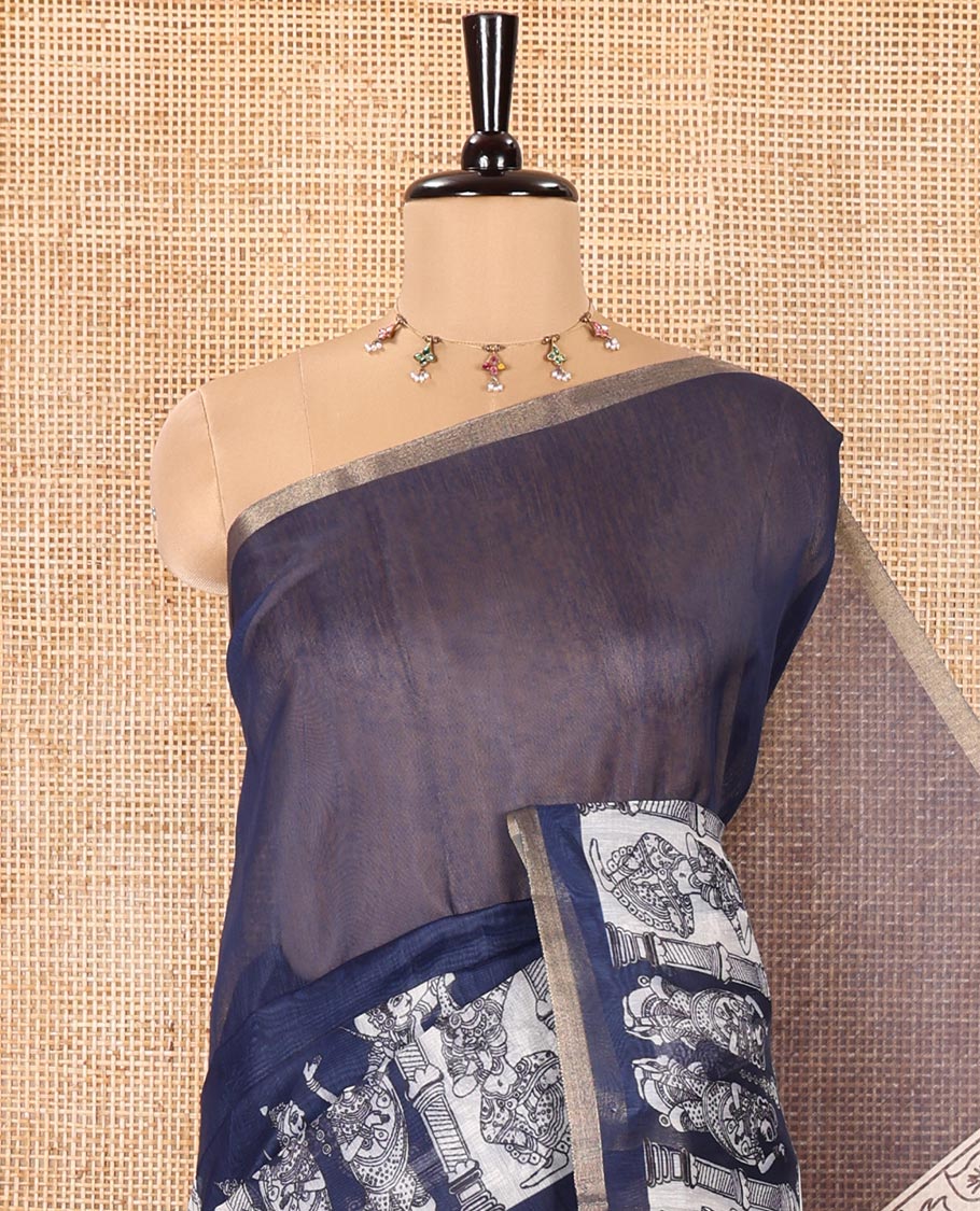 Navy Blue Chanderi Cotton Saree, Elevated with Kalamkari-Style Ancient Human Figurines Printed on Its Body, Subtle Zari Piping Border, Pallu Depicting Kalamkari Peacocks, and Paired with a Matching Blouse