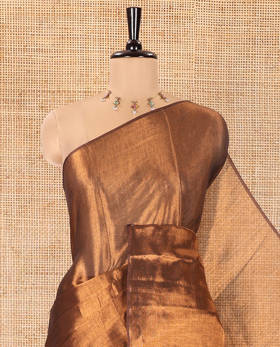 Borderless Copper Plain Khadi Tissue Saree, a Self-Pallu, and Paired with a Matching Blouse