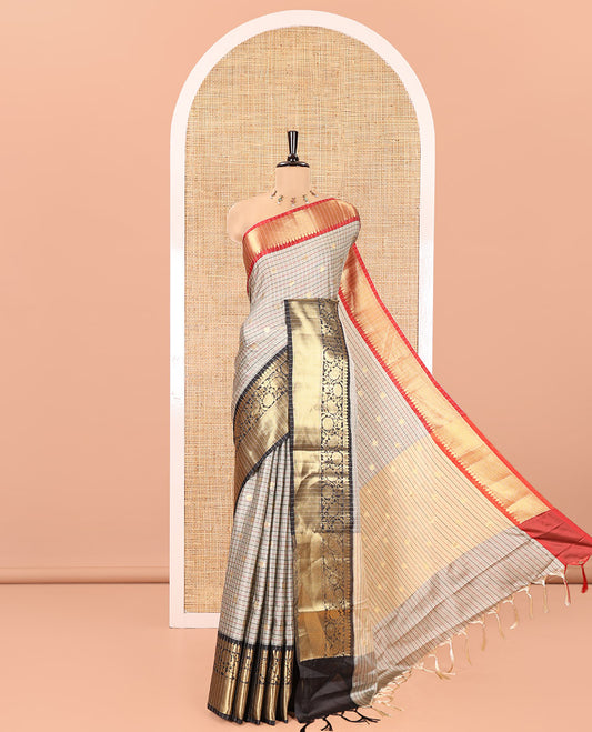 Grey Semi-Soft Silk Saree, Accentuated with Buttas and Checks On Its Body, Complemented by Contrast Traditional Zari Designs Woven Ganga-Jamuna Border, Pallu Steeped with Buttas, and Paired with a Matching Blouse