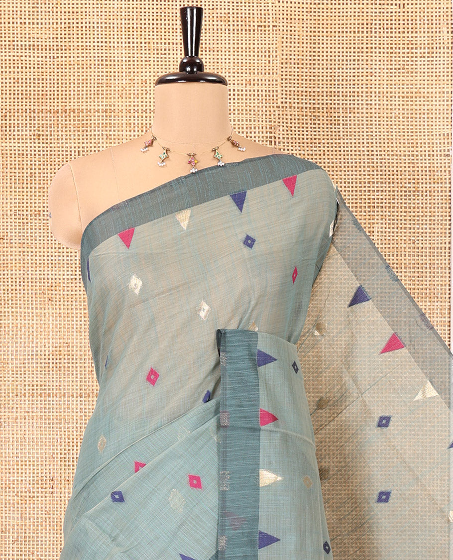 Green Jute Cotton Saree, Adorned with Diamond Meena Buttas All Over Its Body, Complemented by a Contrast Border, Pallu of Jamdhani-Style Floral Designs, and Paired with a Contrast Blouse