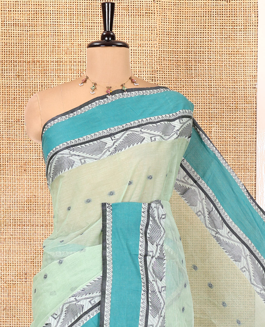 Pista Green Bengal Cotton Saree, Subtly Sparkled with Thread Buttas on Its Body, Complemented by Contrast Thread Border of Floral Creeper Designs, Pallu of Stripes and Buttas, and Paired with a Matching Blouse