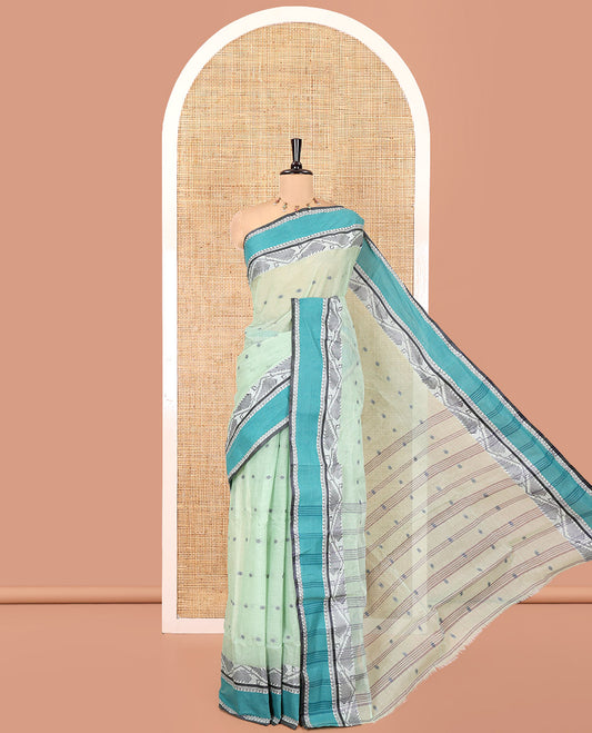 Pista Green Bengal Cotton Saree, Subtly Sparkled with Thread Buttas on Its Body, Complemented by Contrast Thread Border of Floral Creeper Designs, Pallu of Stripes and Buttas, and Paired with a Matching Blouse