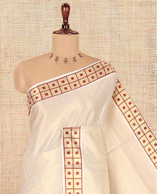 Gold-Maroon Plain Kerala Tissue Saree Features a Butta Enclosed Checked Border, and a Matching Blouse