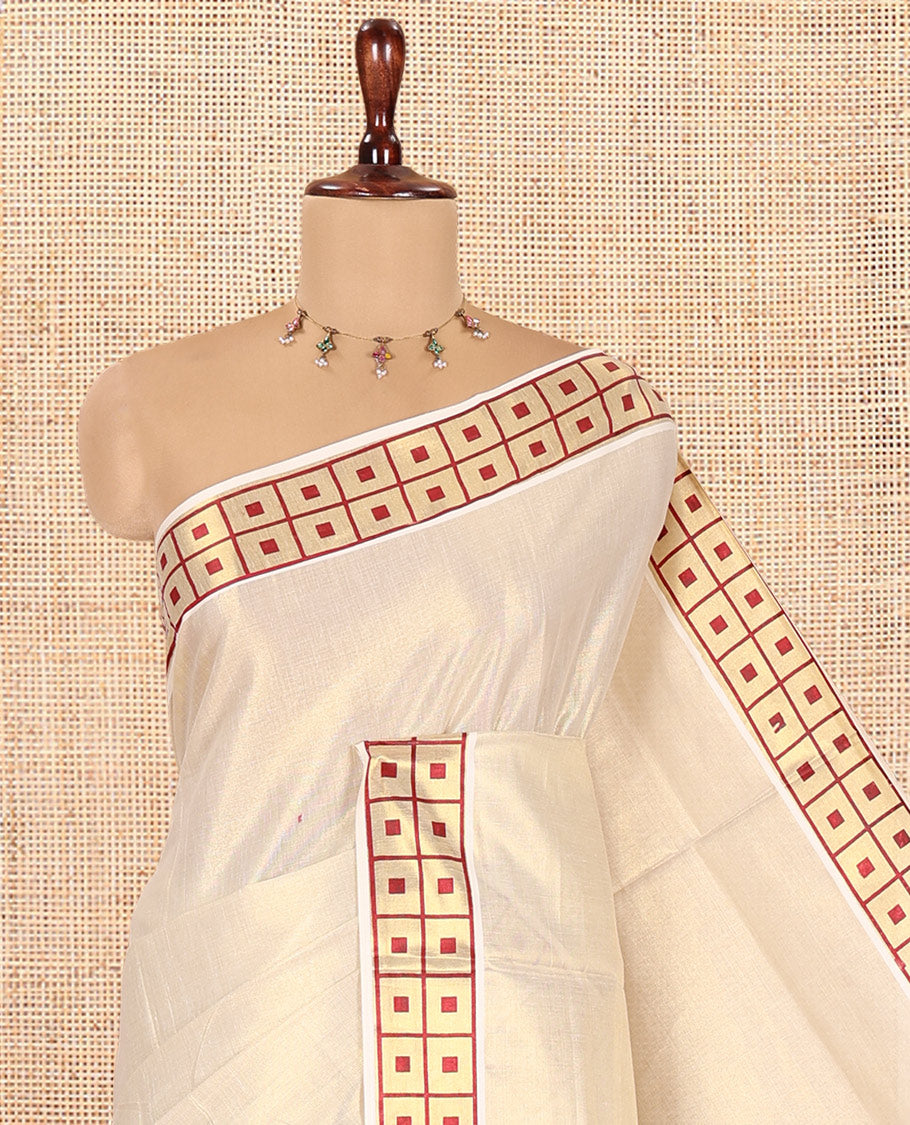 Gold-Maroon Plain Kerala Tissue Saree Features a Butta Enclosed Checked Border, and a Matching Blouse