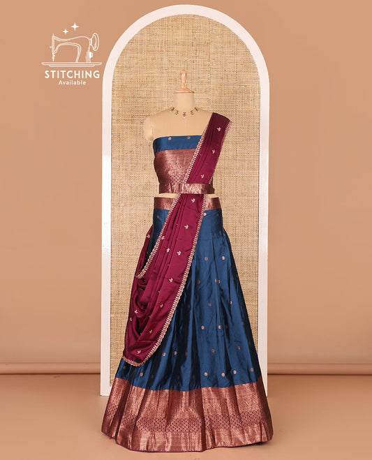 Peacock blue taffeta silk half-saree, flower zari buttas and contrast traditional zari bordered skirt, a matching blouse, and contrast embroidered satin georgette scallop dhavani